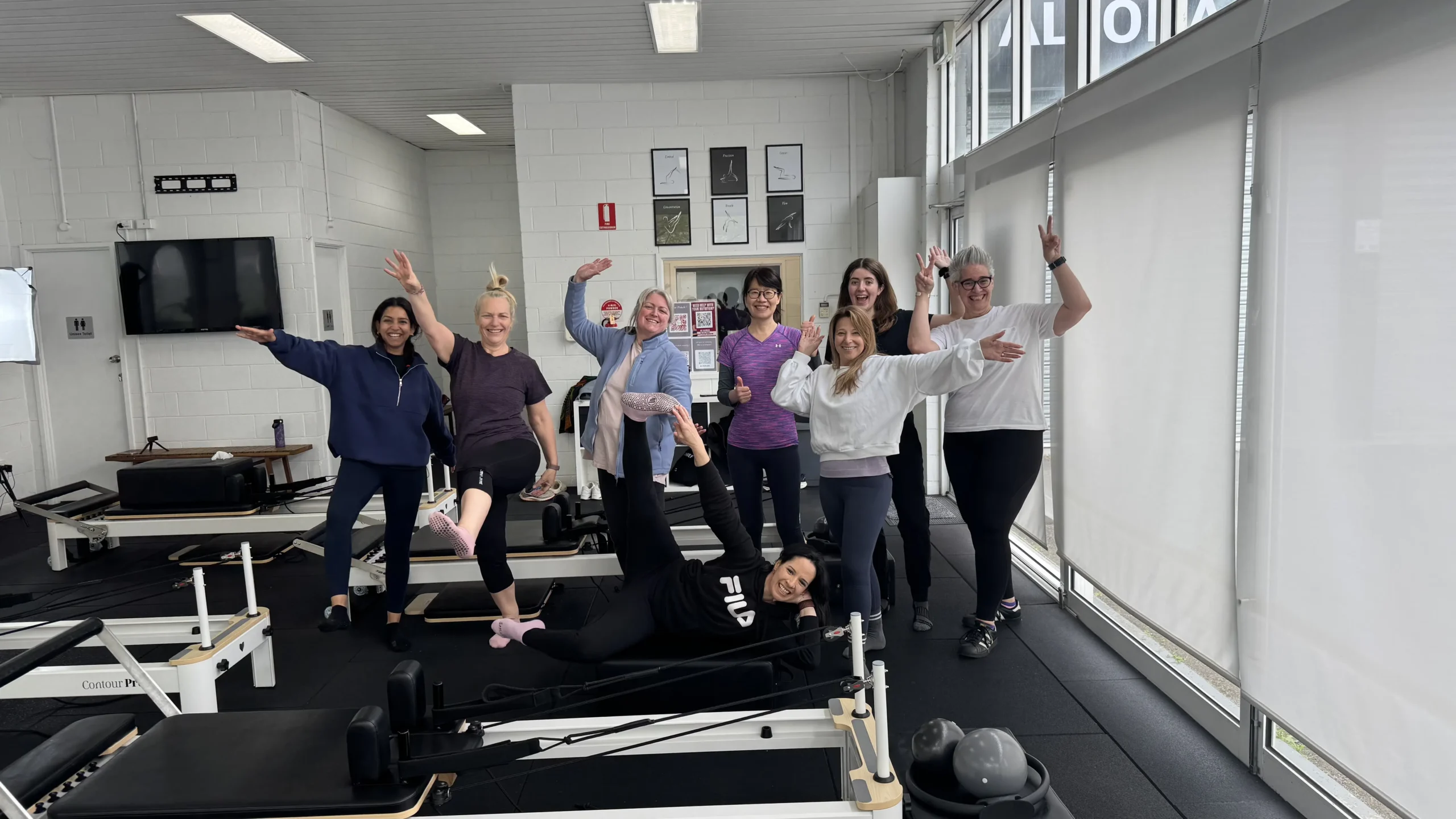 4You Pilates group photo in the studio.
